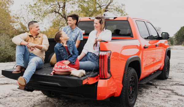 The Palacious family in the bed of their new Toyota truck