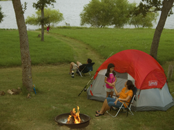 Family camping by lake