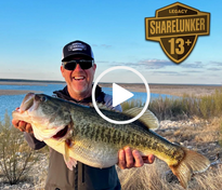 Thaddeus Galey holds 13.19' Legacy Lunker, video link