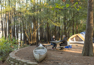 Tent and canoe on elevated campsite at Caddo Lake SP, link