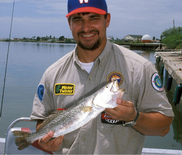 Man holding spotted seatrout