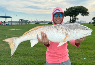 Picture of Bao holding a 38' redfish