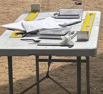 Picture of table with equipment used for measuring fish