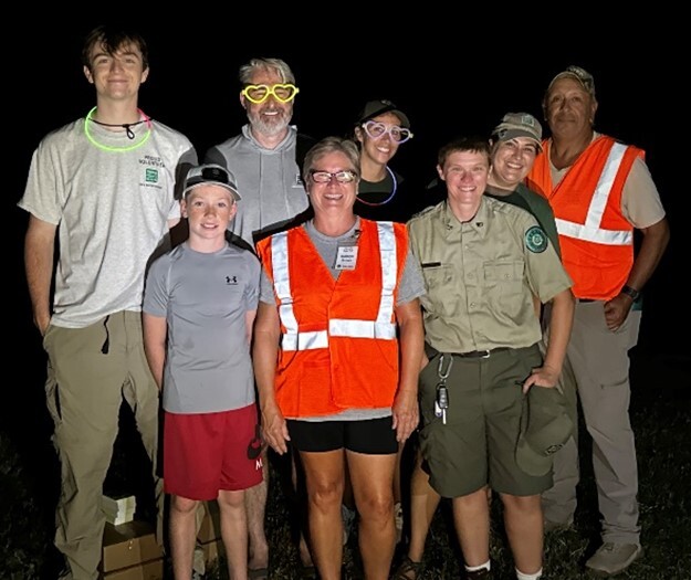 Picture of volunteers working the night fishing event