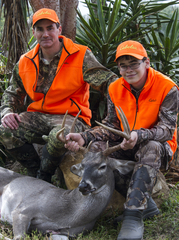 Hunt mentor and boy with buck harvest