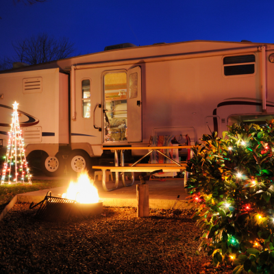 A campsite decorated with holiday lights. 