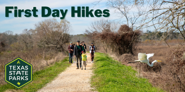 A family hiking a trail at Brazos Bend.