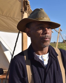 Allen in front of a tent