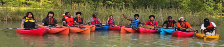 youth in kayaks