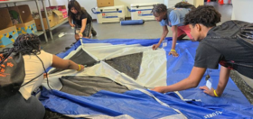 Students setting up a tent