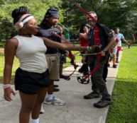 Youth shooting archery