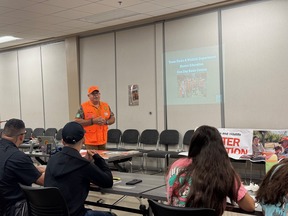 Hunter Ed instructor at front of class giving presentation