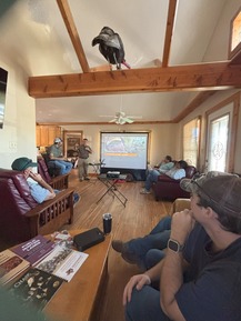 Students getting class in hunting lodge