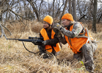 2 hunters in tall grass