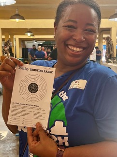 Woman holding up target