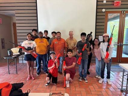 Kids pose with instructor in class