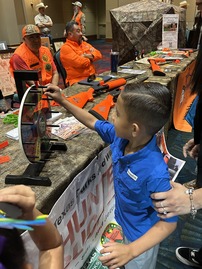 Kid spins roulette wheel