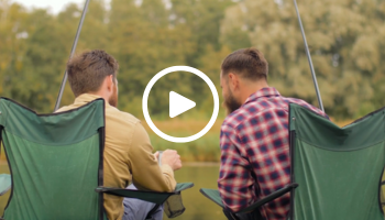 2 anglers looking at a phone, video link