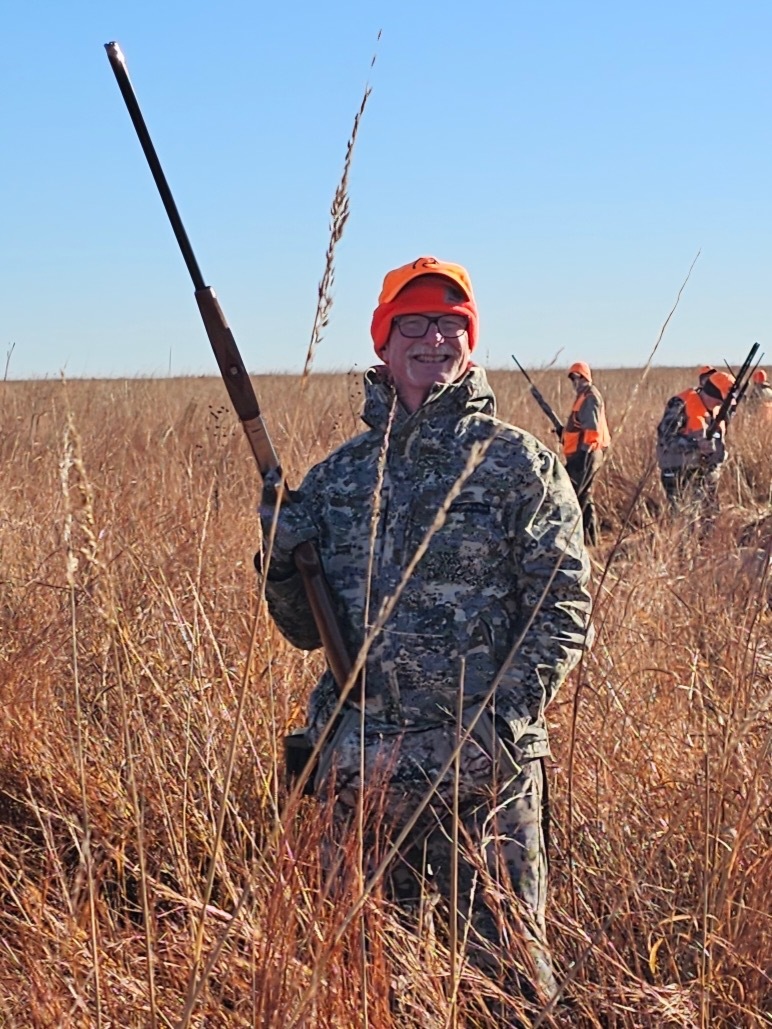 Hunter ed instructor posing with shotgun