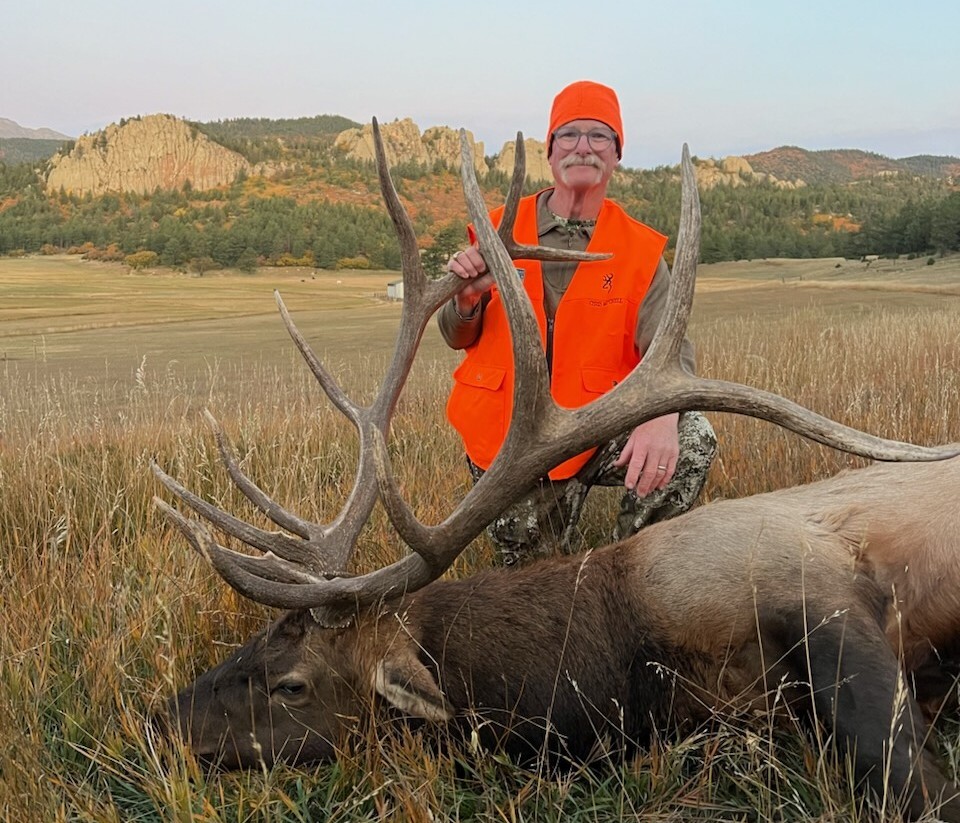 Hunter poses with an elk he harvested