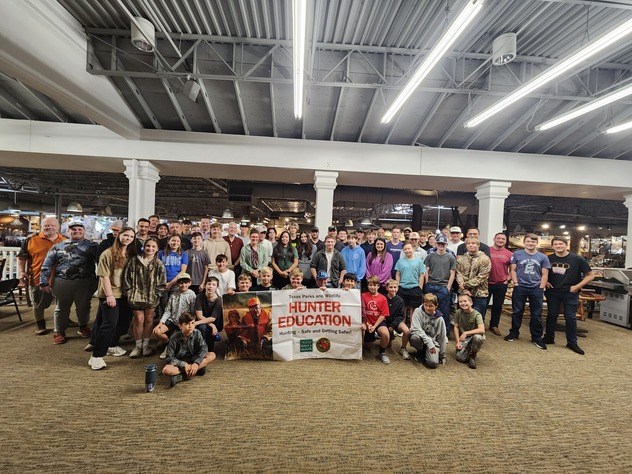 Class picture of a very large Hunter Education class with 56 students