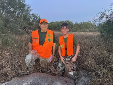 Hunting Student and guide pose with harvest