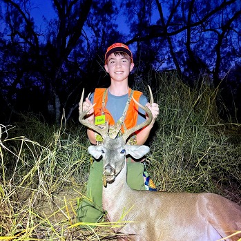 Hunting student poses with harvest
