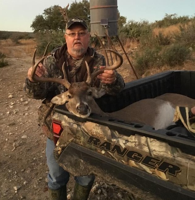 Hunter Ed Area Chief posing with harvested deer