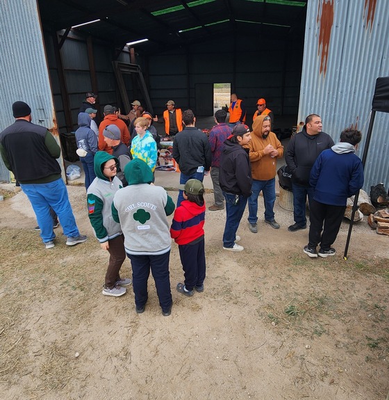 Families gather around Hunter Ed table at expo