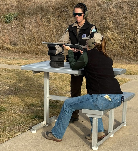 Game Warden teaching rifle shooting