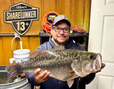 Ross Gomez hold 13.74 lb Legacy Lunker, link 