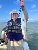 Picture of a mentee catching a fish