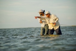 Picture of two men fly fishing in salt water