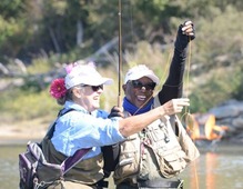 Picture of 2 women in CfR catching fish