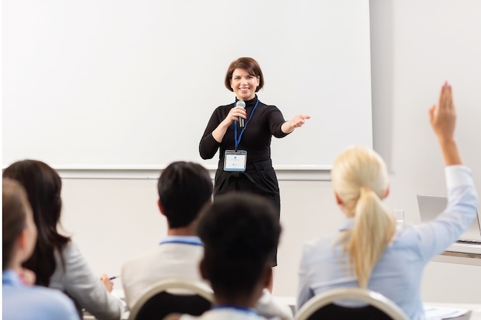 Educator teaching to classroom of students