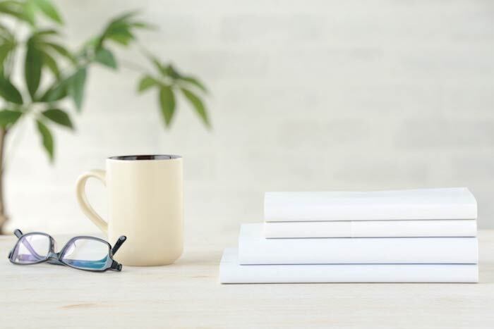 Books and coffee mug on a table