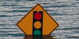 traffic sign submerged in flood water