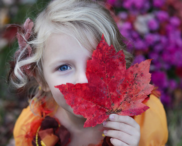 girl with autumn leaf