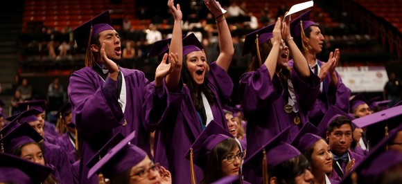 Graduates in purple gowns