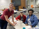 STEM teacher and students at table