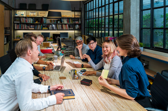 Educators sitting at a table having a discussion