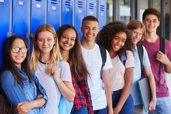 high school students standing by lockers, Adobe Stock