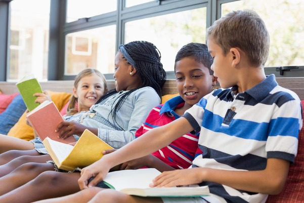 image of students reading and laughing together