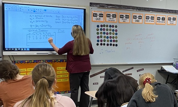 Teacher working through division