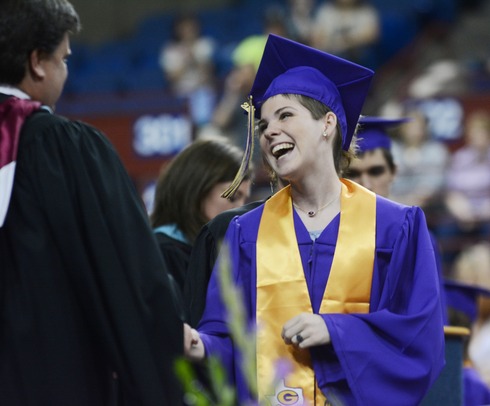 student receiving diploma