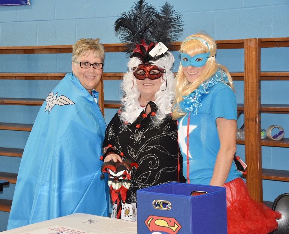 image of teachers dressed up as superheroes