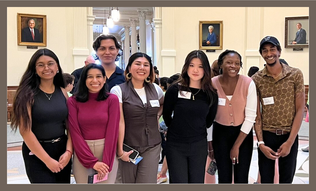 Seven scholars standing together