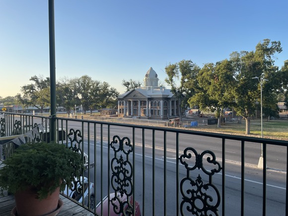 Sunrise view from the second-story porch of Red Door Bed & Breakfast, overlooking the courthouse square.