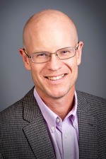 Image of a man in a gray suit