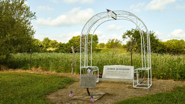 Color photograph of headstone for Texas blues guitarist Blind Lemon Jefferson.